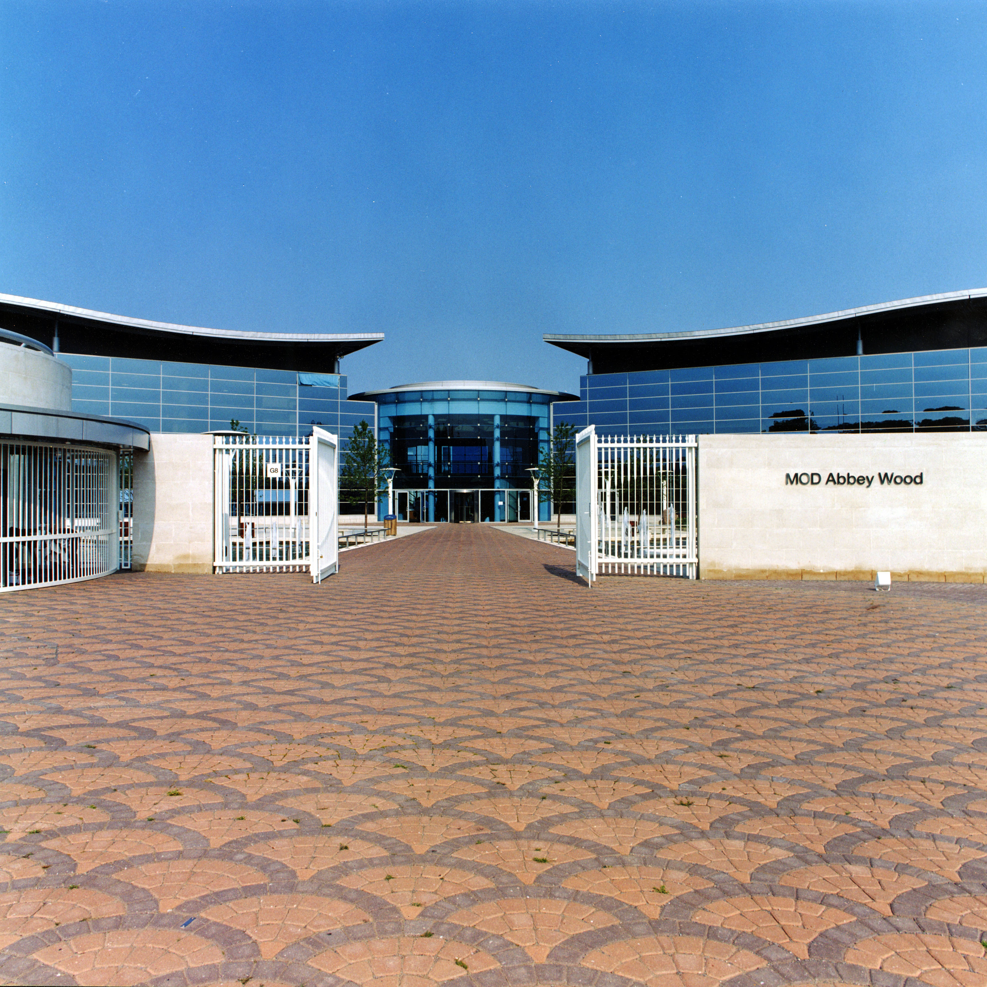 MoD Abbey Wood Entrance. MoD Abbey Wood is a purpose-built site in Filton, Bristol, United Kingdom, that houses the Defence Equipment and Support procurement organisation. The building project involved over 130,000 m² of buildings including offices, restaurants, library, sports facilities, training rooms, auditoria and conferences rooms, support facilities and a crèche together with landscaping and external works on a 98-acre (400,000 m2) site.